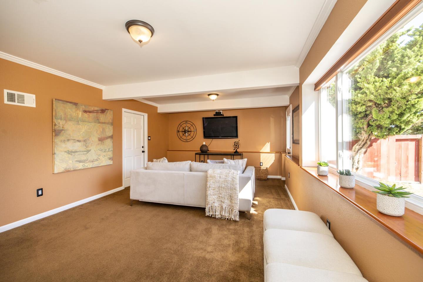 1420 Crespi Drive Pacifica, CA 94044 - Photo 18 of 48 a living room with furniture and a large window