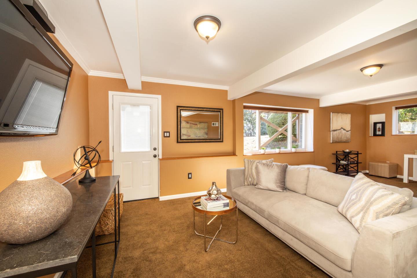 1420 Crespi Drive Pacifica, CA 94044 - Photo 25 of 48 a living room with furniture or couch and a flat screen tv