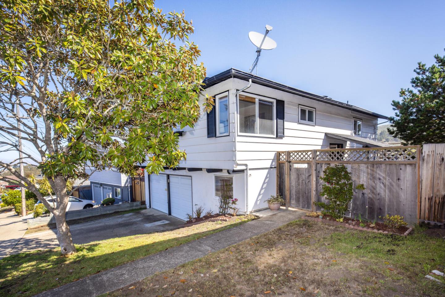 1420 Crespi Drive Pacifica, CA 94044 - Photo 3 of 48 a front view of a house with a yard
