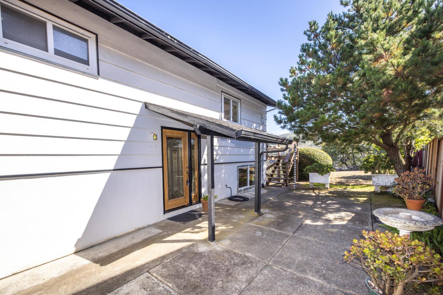 1420 Crespi Drive Pacifica, CA 94044 - Photo 31 of 48 a backyard of a house with outdoor seating