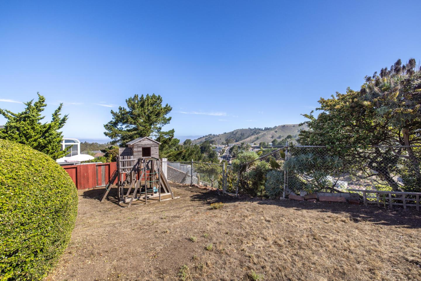 1420 Crespi Drive Pacifica, CA 94044 - Photo 43 of 48 a view of a chairs and table in the backyard