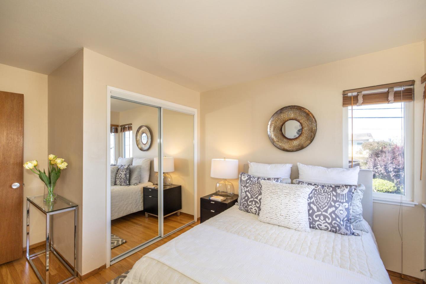 1420 Crespi Drive Pacifica, CA 94044 - Photo 5 of 48 a bedroom with a bed and window