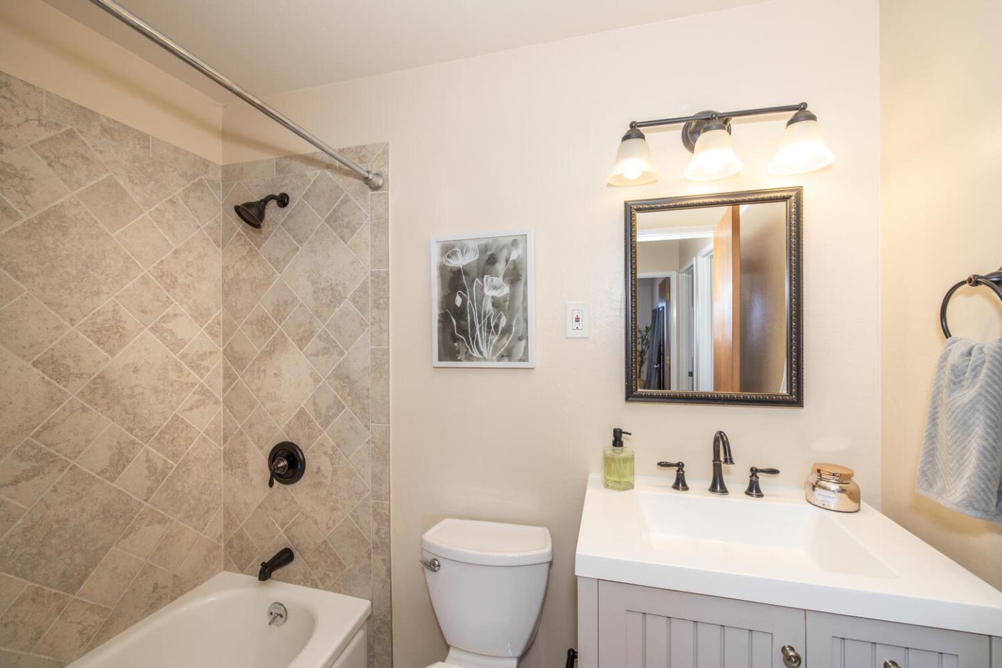 1420 Crespi Drive Pacifica, CA 94044 - Photo 8 of 48 a bathroom with a toilet sink vanity tub and shower