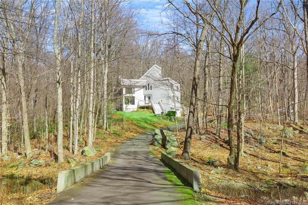 a view of a brick house with many windows