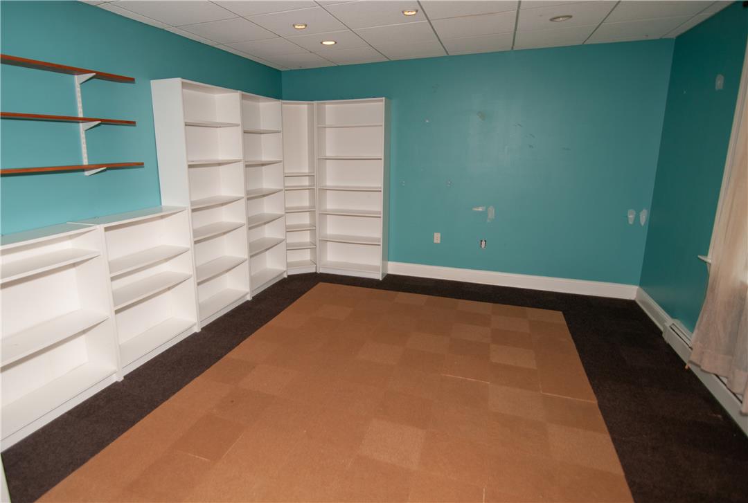 2202 High Meadow Road Coopersburg, PA 18036 - Photo 38 of 41 Ample built-in shelving and recessed lighting accent this versatile lower level room.