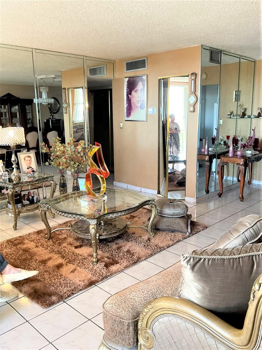 4675 West 18th Court, Unit 502 Hialeah, FL 33012 - Photo 7 of 13 a living room filled with furniture