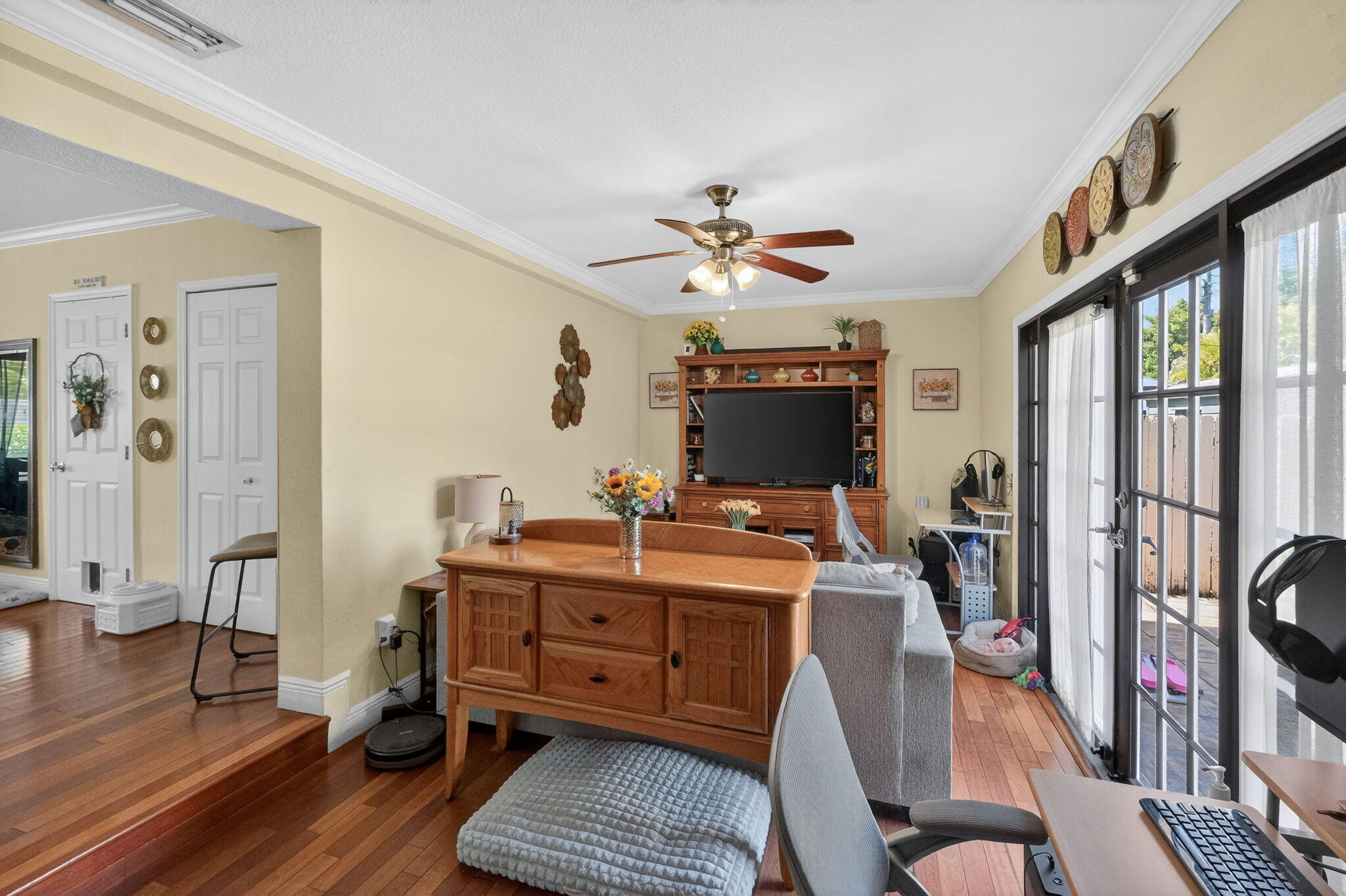 6091 Southwest 12th Street West Miami, FL 33144 - Photo 14 of 38 a view of a livingroom with workspace and a window
