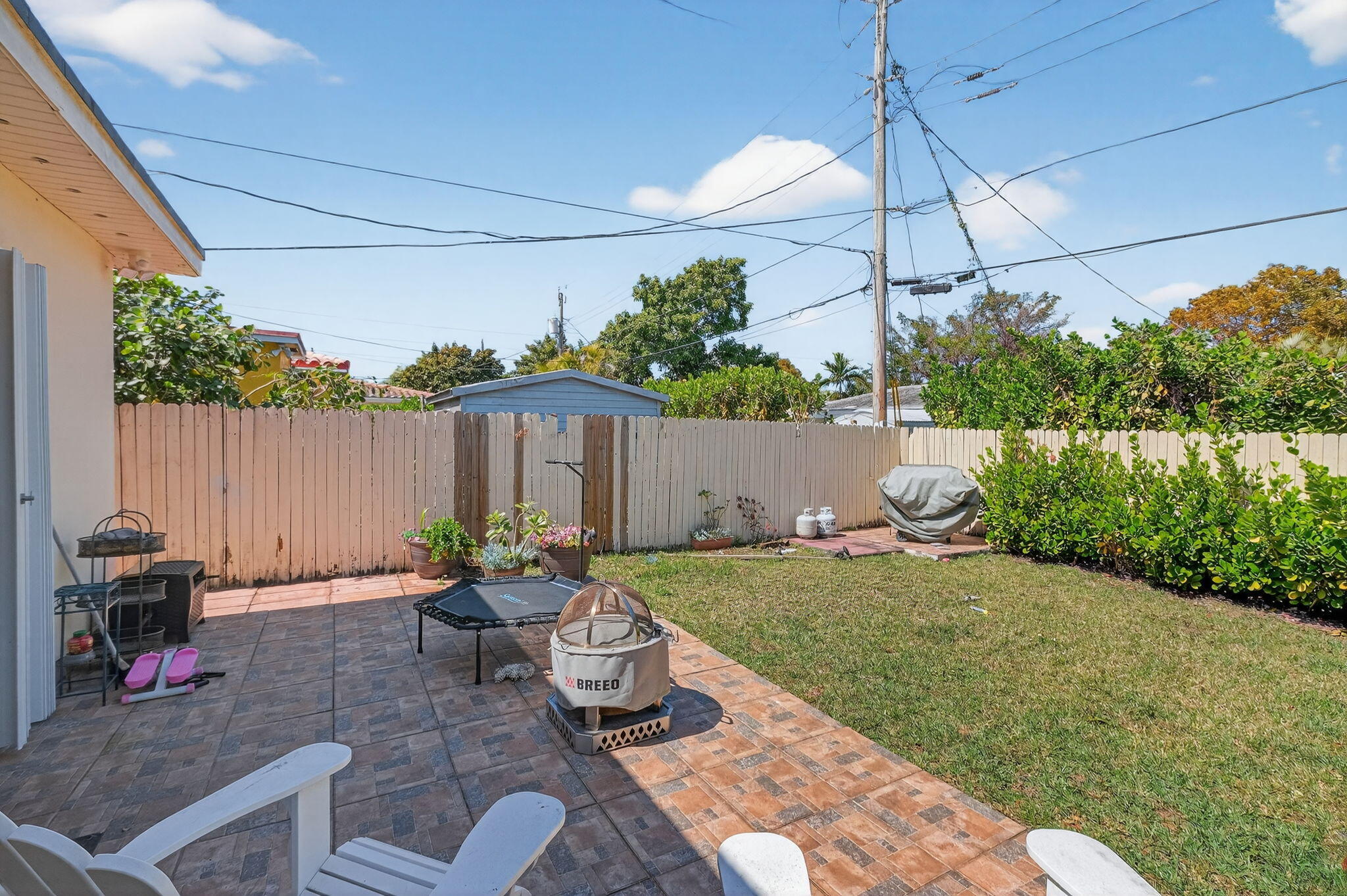 6091 Southwest 12th Street West Miami, FL 33144 - Photo 26 of 38 a view of a backyard with plants and a patio