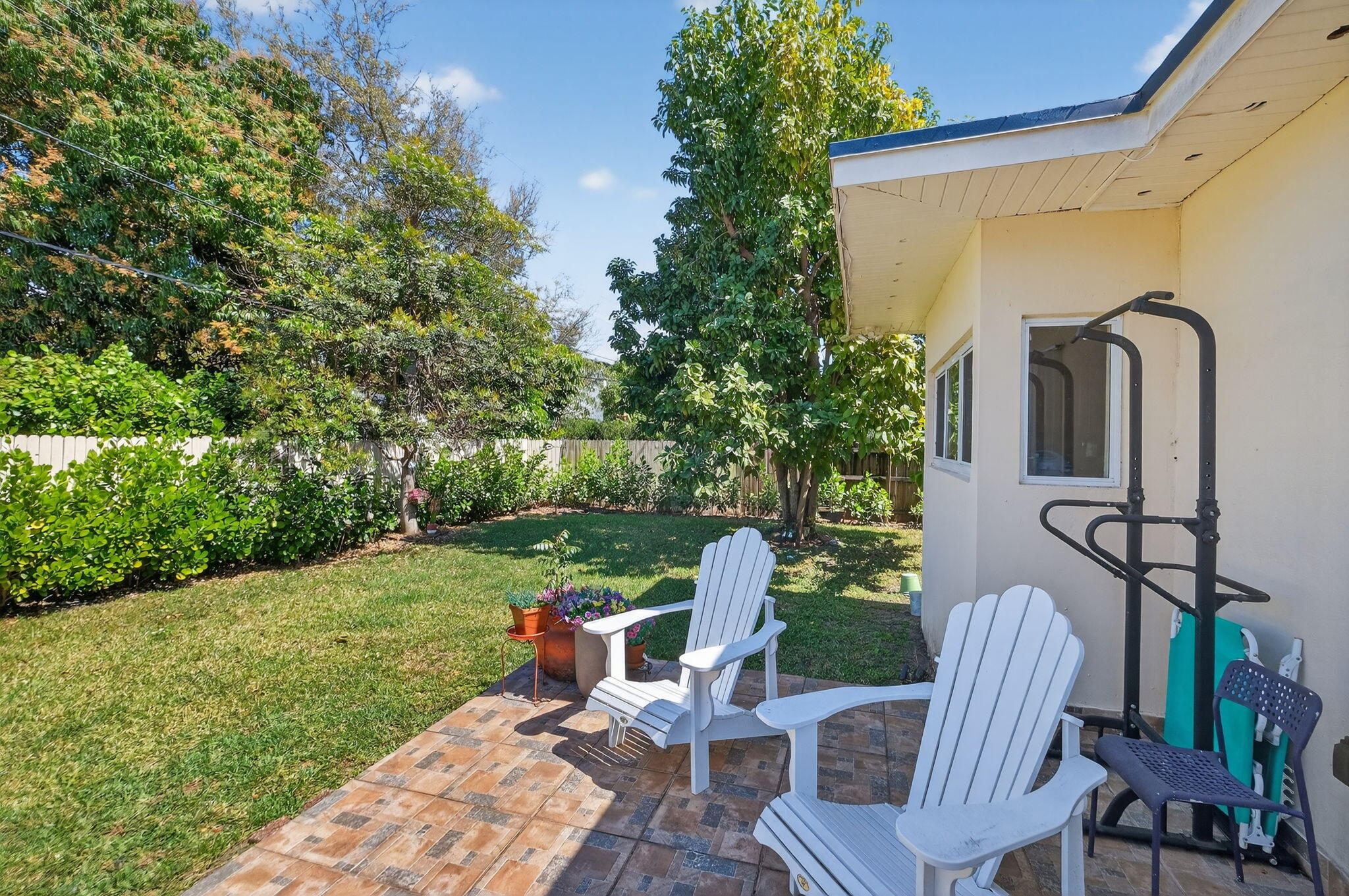 6091 Southwest 12th Street West Miami, FL 33144 - Photo 27 of 38 a view of a chair and table in backyard of the house