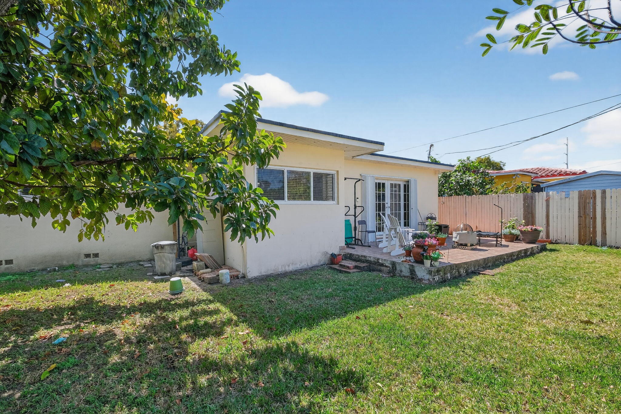 6091 Southwest 12th Street West Miami, FL 33144 - Photo 29 of 38 a view of a house with backyard and sitting area