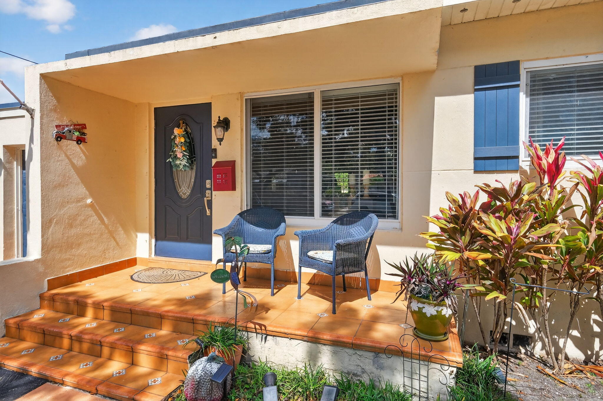 6091 Southwest 12th Street West Miami, FL 33144 - Photo 3 of 38 a view of a patio with table and chairs and potted plants
