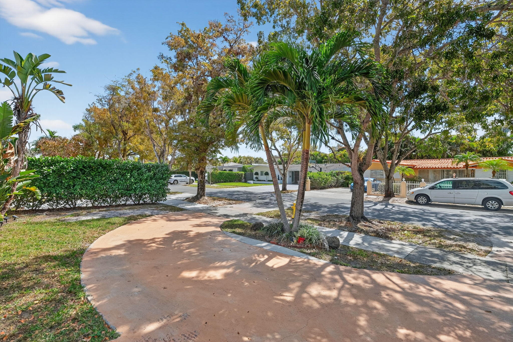 6091 Southwest 12th Street West Miami, FL 33144 - Photo 33 of 38 a view of a street with a building and trees in the background