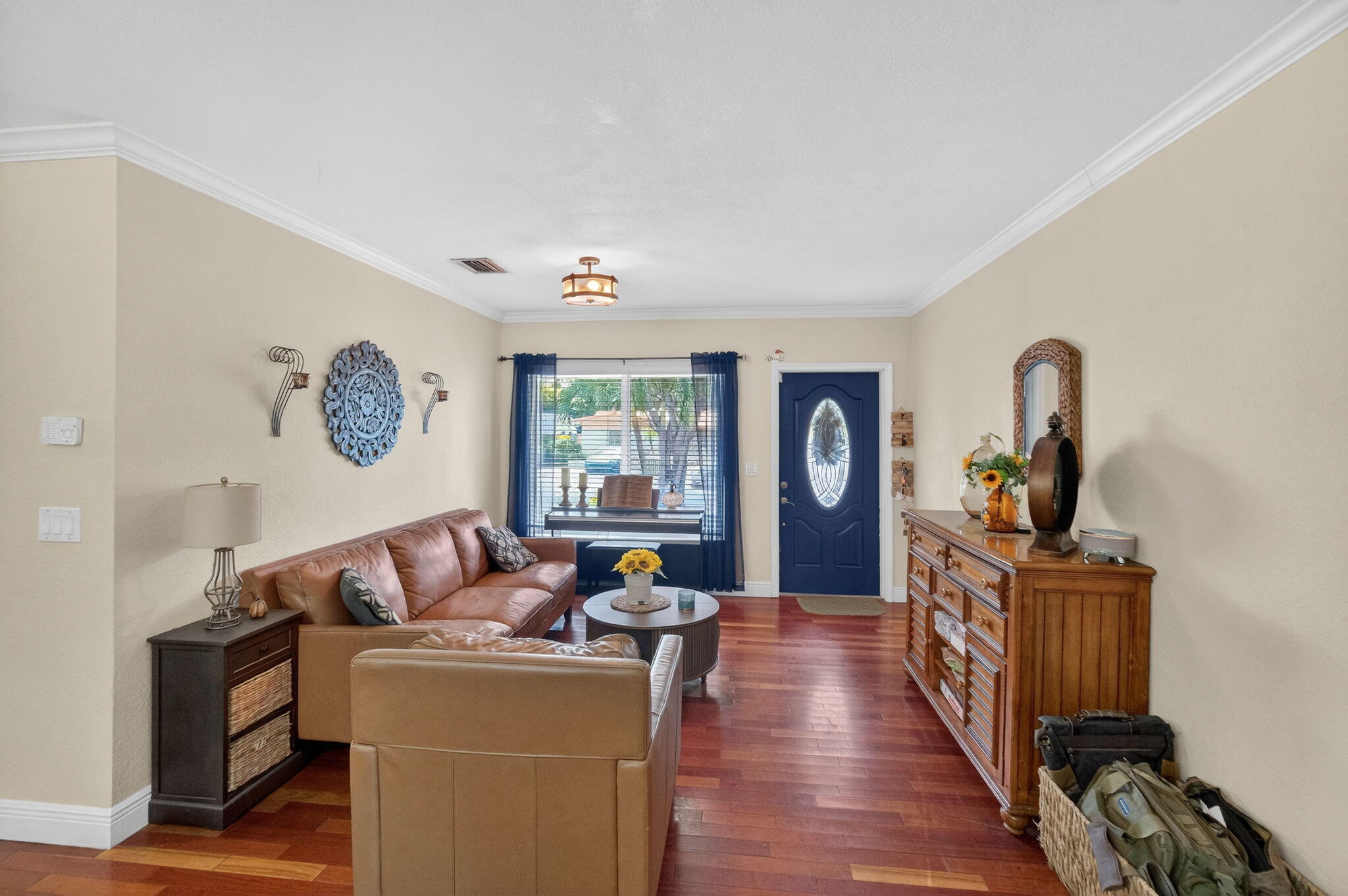 6091 Southwest 12th Street West Miami, FL 33144 - Photo 4 of 38 a living room with furniture a window and wooden floor