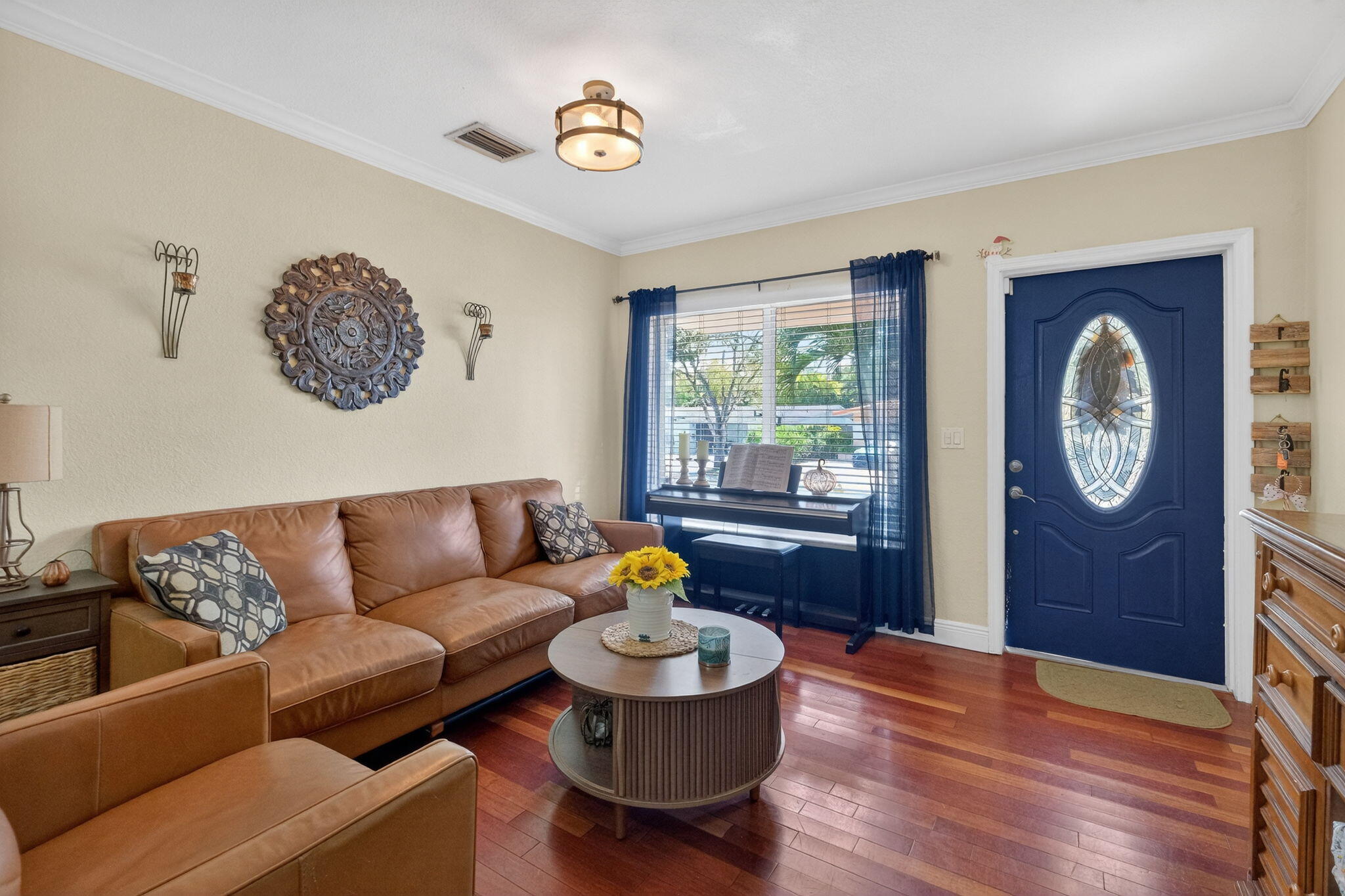 6091 Southwest 12th Street West Miami, FL 33144 - Photo 5 of 38 a living room with furniture and a wooden floor