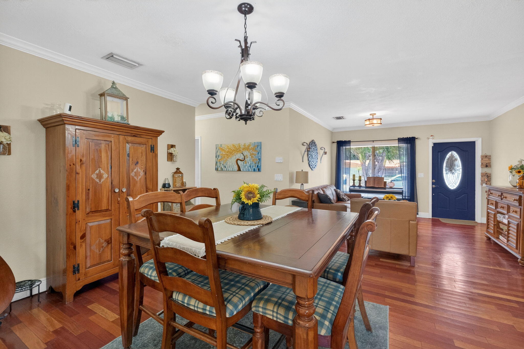 6091 Southwest 12th Street West Miami, FL 33144 - Photo 8 of 38 a view of a dining room with furniture and wooden floor