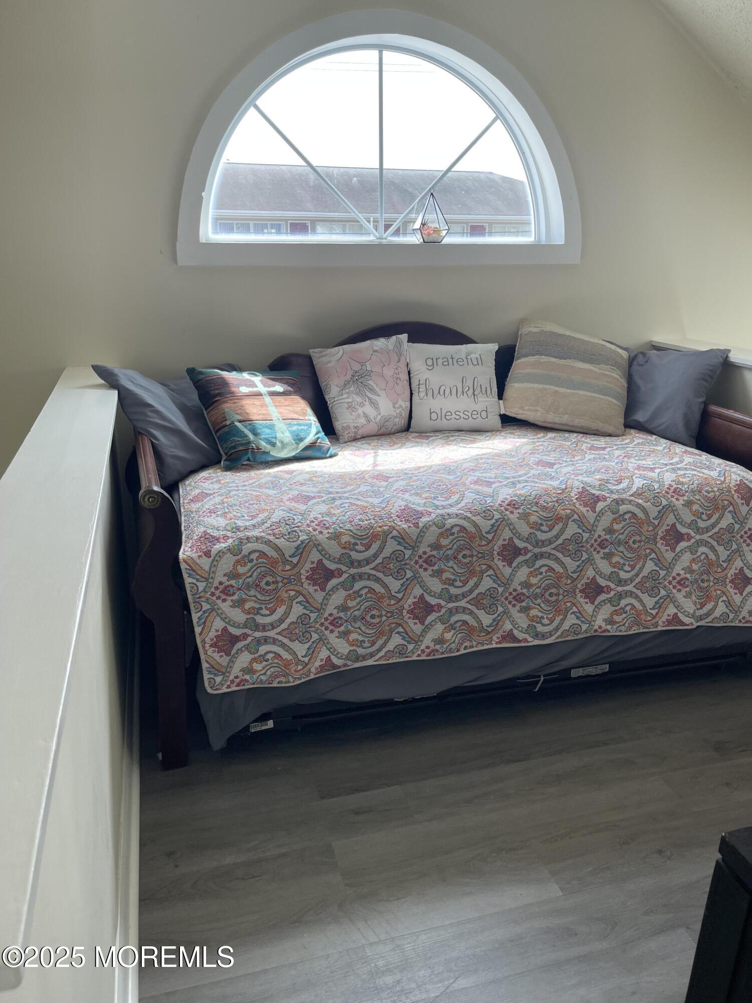 202 Carteret Avenue, Unit B5 Seaside Heights, NJ 08751 - Photo 11 of 17 a bedroom with a bed and window