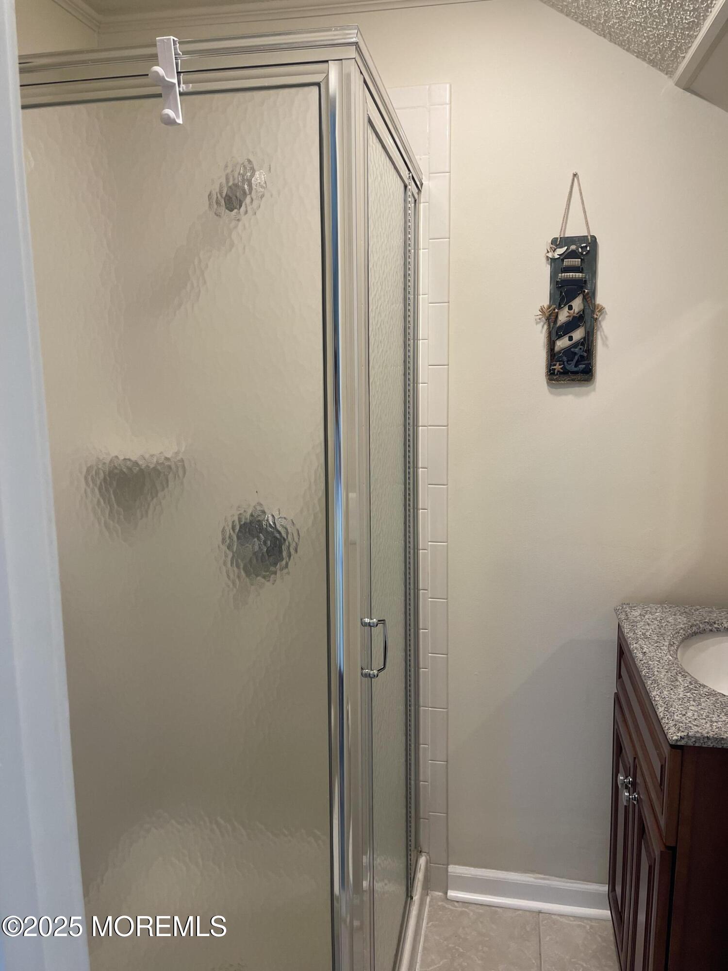 202 Carteret Avenue, Unit B5 Seaside Heights, NJ 08751 - Photo 15 of 17 a bathroom with a shower and a sink