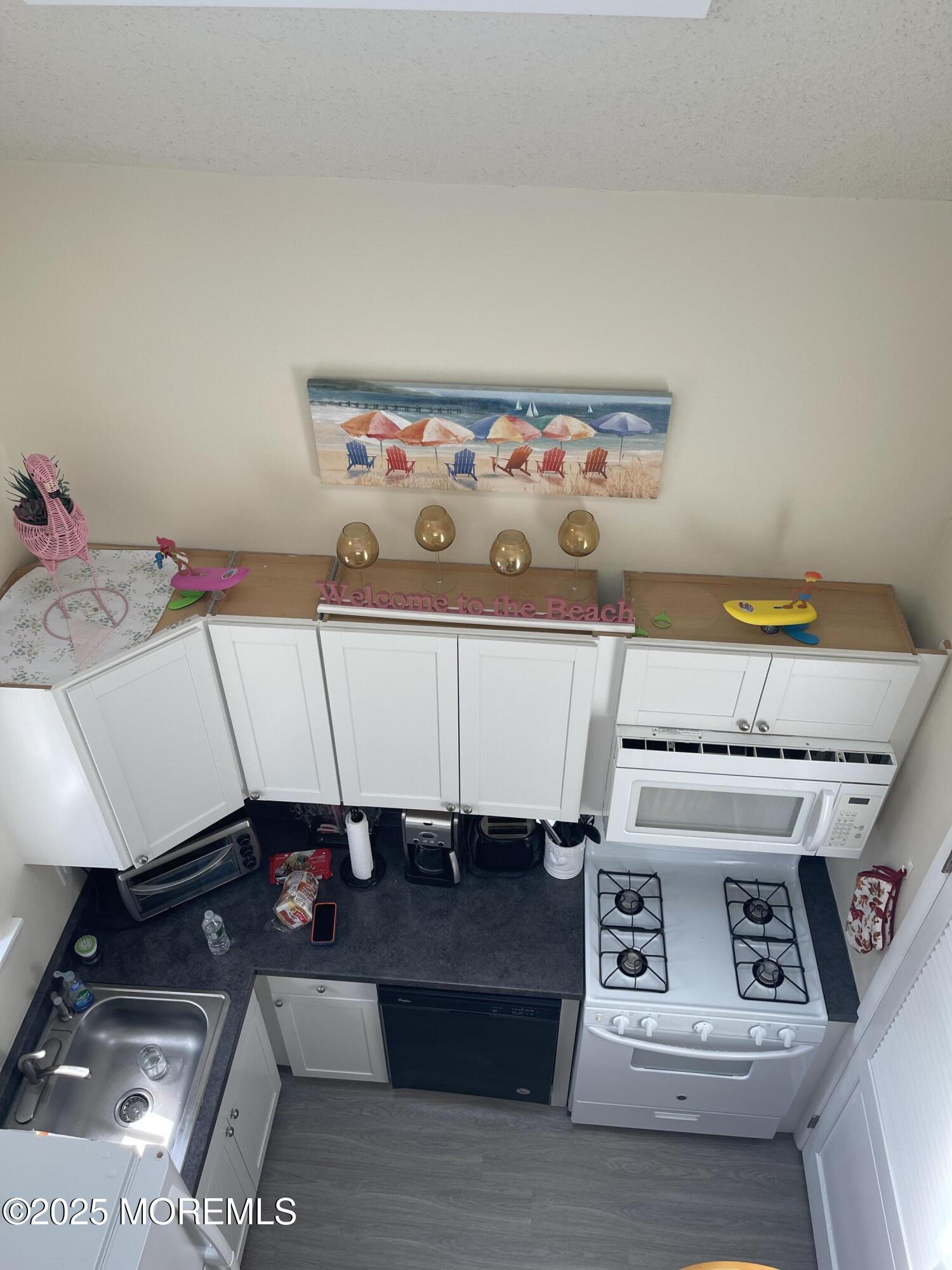 202 Carteret Avenue, Unit B5 Seaside Heights, NJ 08751 - Photo 3 of 17 a utility room with washer and dryer