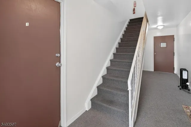 a view of a hallway with staircase