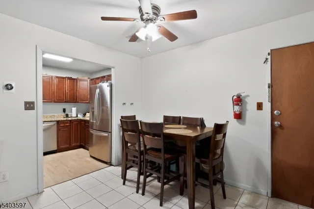 a view of a dining room with furniture and a chandelier