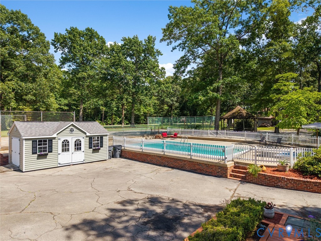 13099 Cedon Road Ashland, VA 23005 - Photo 78 of 92 Outdoor swimming pool with white picket fencing, a