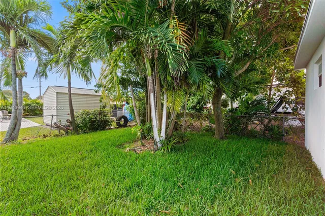 a view of a backyard with a garden
