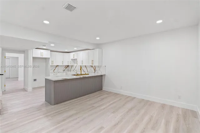 a view of kitchen with wooden floor