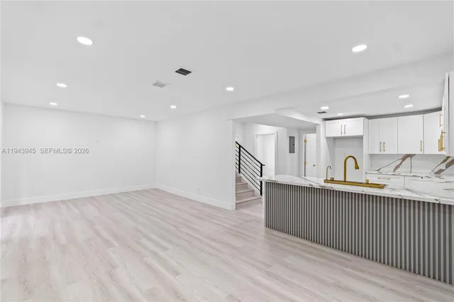 a view of kitchen with wooden floor