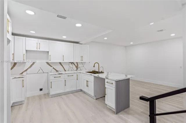 a view of a kitchen with appliances