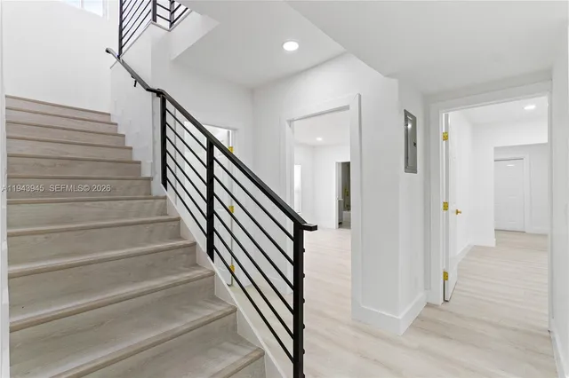 a view of entryway with wooden floor