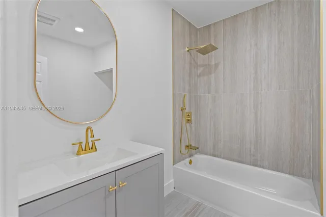 a bathroom with a sink a toilet and a bathtub