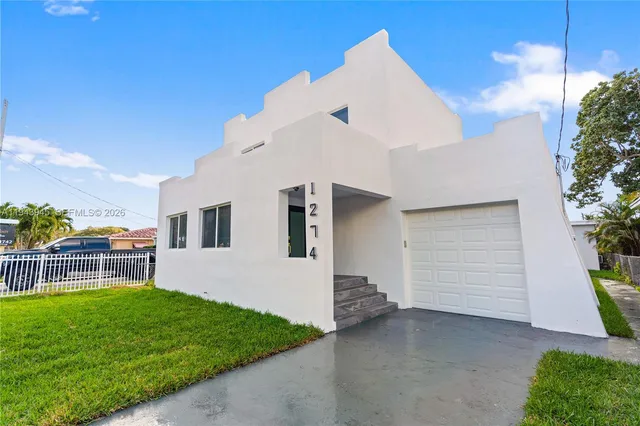 a view of house with backyard