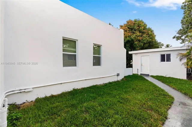 a house view with a backyard space