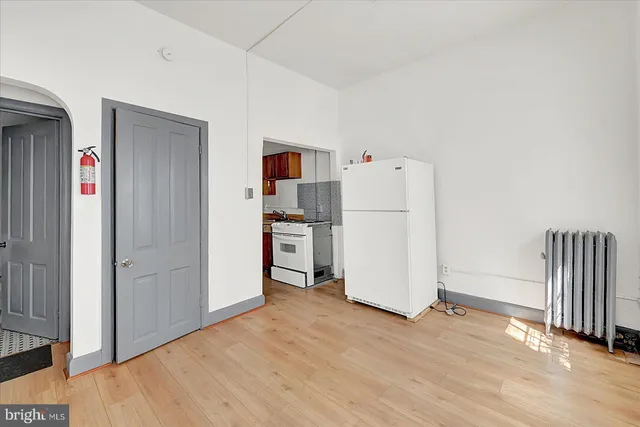 an empty room with wooden floor