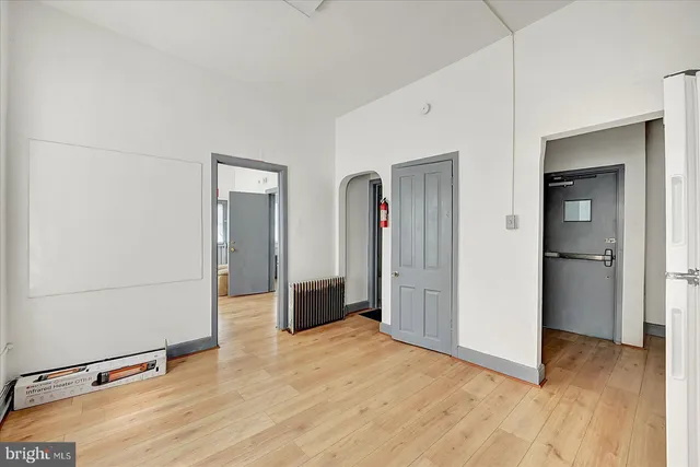 a view of a room with wooden floor and stairs