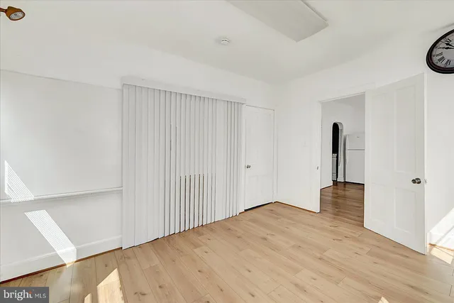 a view of a workspace with furniture and wooden floor
