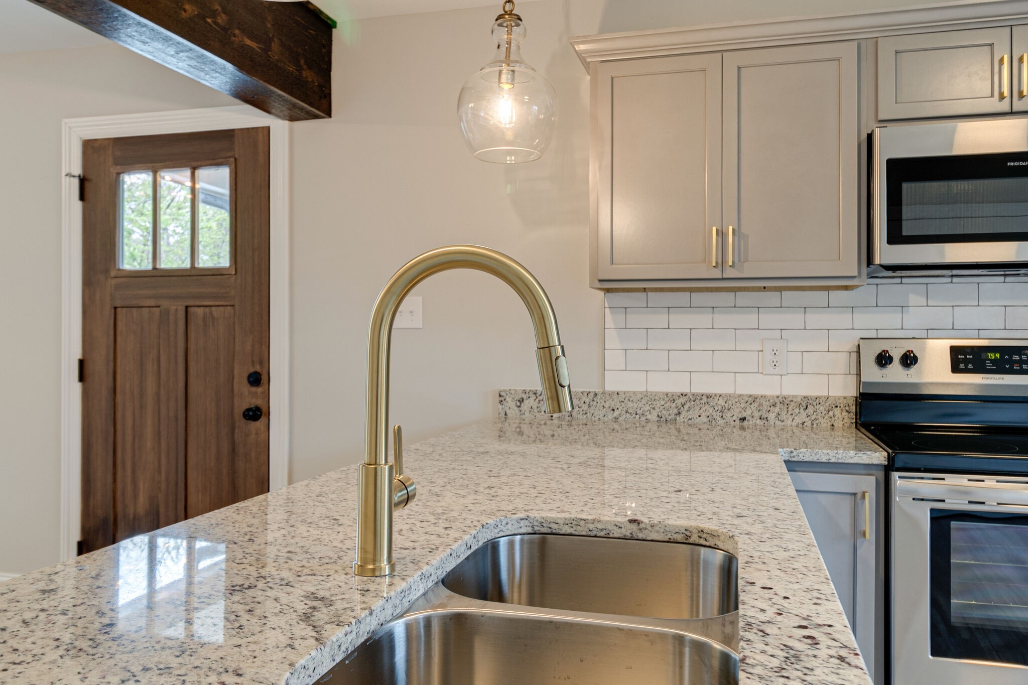 1008 Beckett Street, Unit A Columbia, TN 38401 - Photo 11 of 29 a kitchen with a sink and a microwave