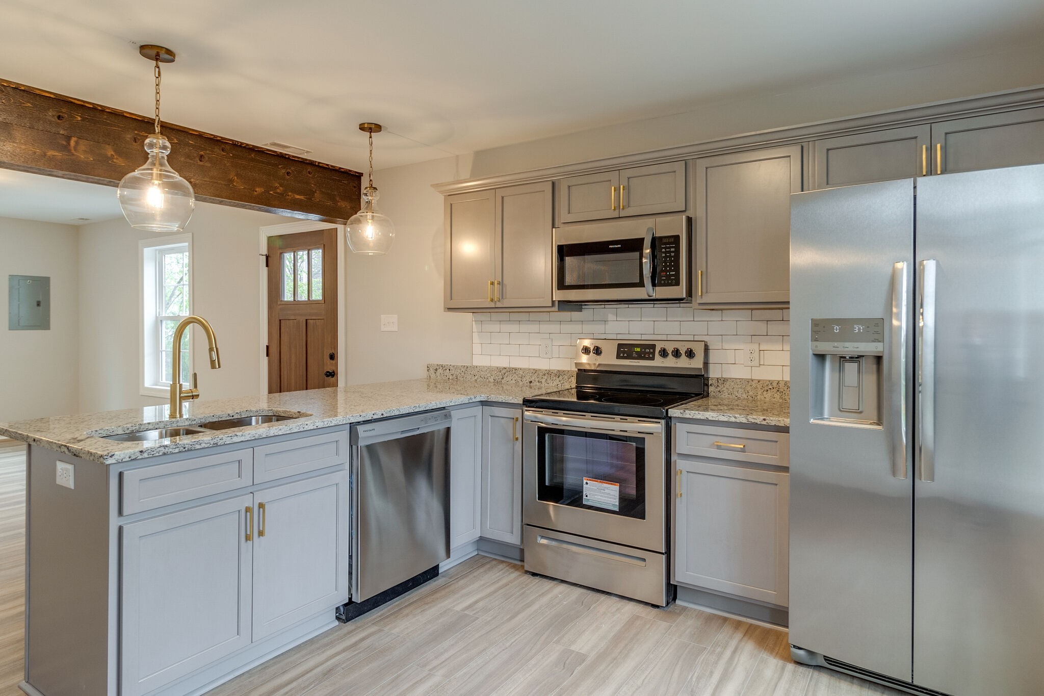 1008 Beckett Street, Unit A Columbia, TN 38401 - Photo 12 of 29 a kitchen with a refrigerator stove and sink