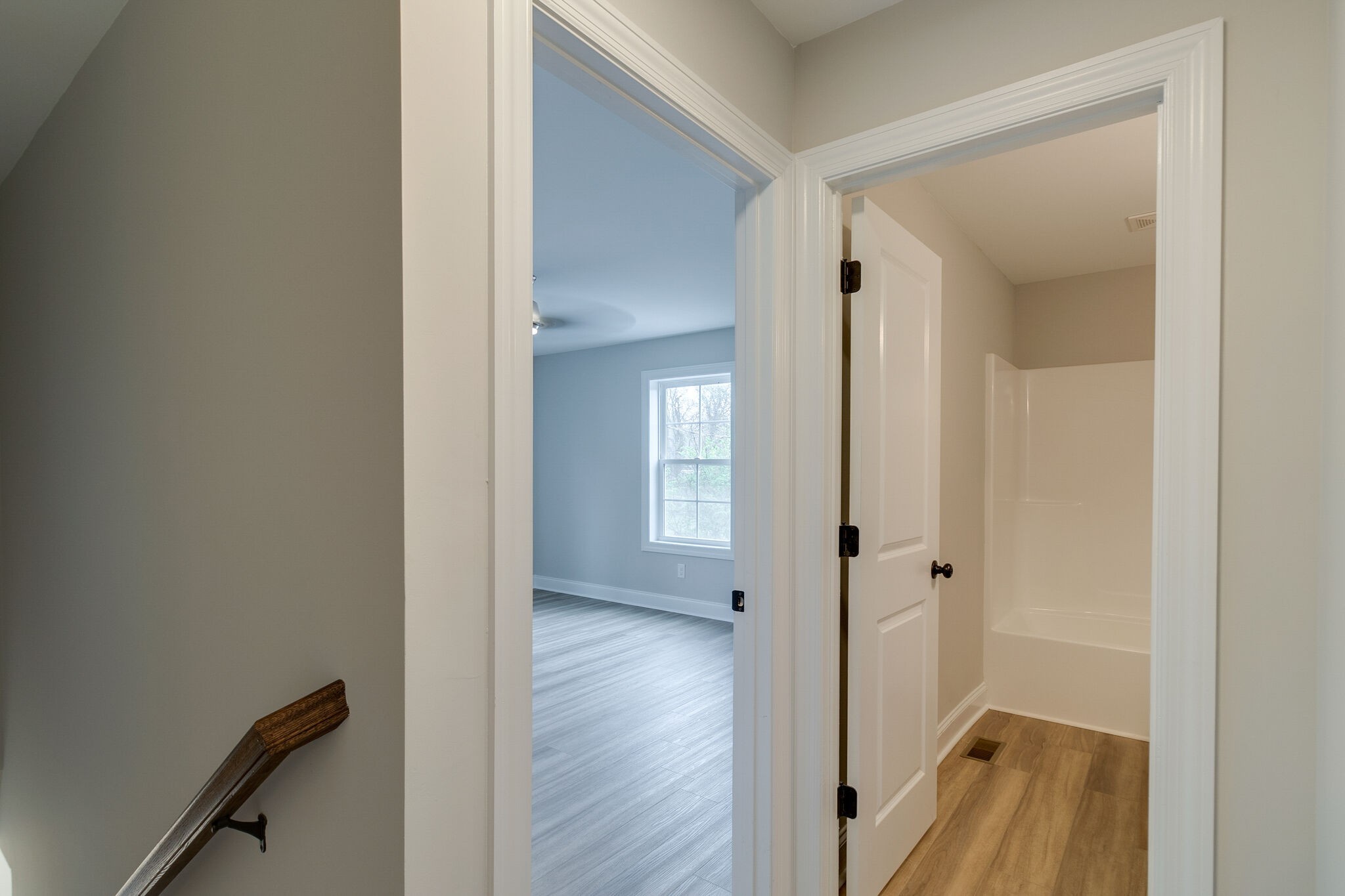1008 Beckett Street, Unit A Columbia, TN 38401 - Photo 17 of 29 a view of a hallway with wooden floor and a bathroom