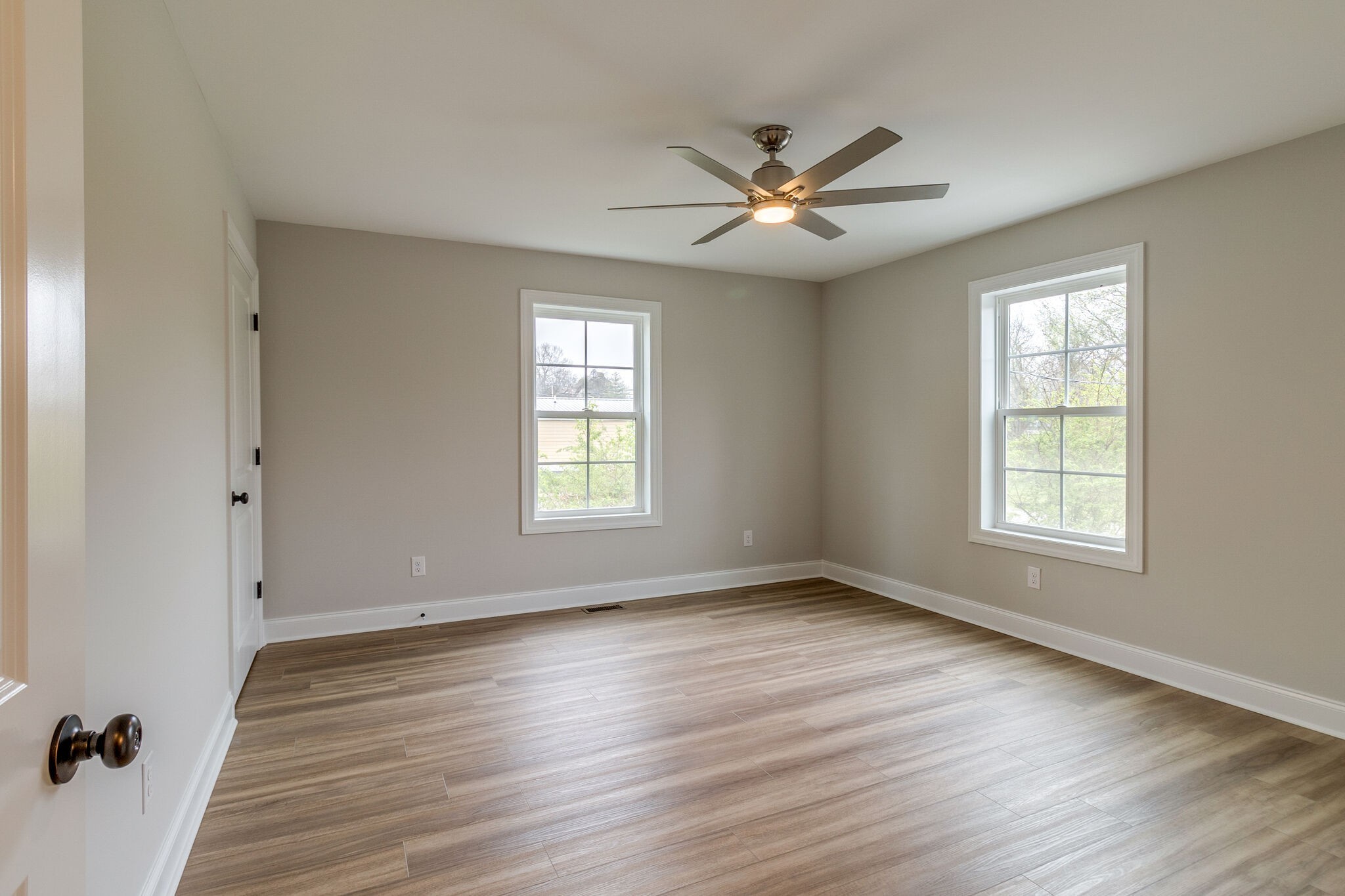 1008 Beckett Street, Unit A Columbia, TN 38401 - Photo 18 of 29 a view of an empty room with wooden floor and a window