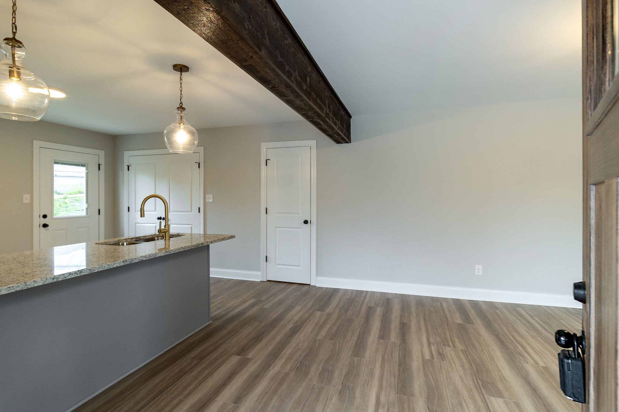 1008 Beckett Street, Unit A Columbia, TN 38401 - Photo 5 of 29 a view of a kitchen with a sink and wooden floor