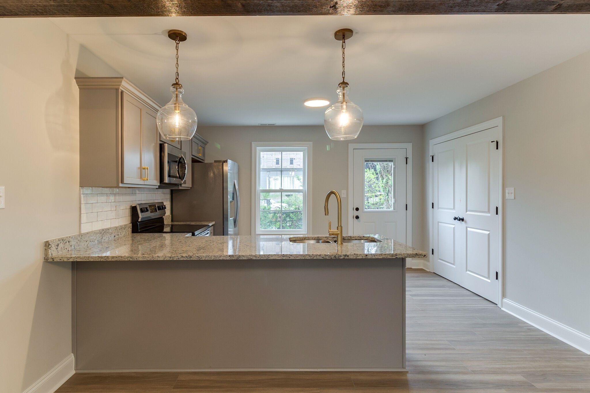 1008 Beckett Street, Unit A Columbia, TN 38401 - Photo 9 of 29 a view of a kitchen counter space a sink and wooden floor
