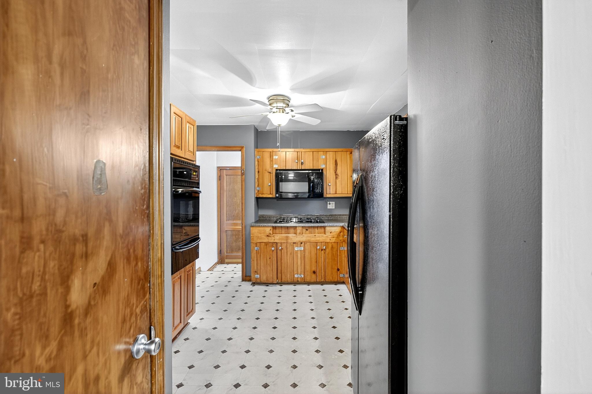 721 South Halsey Road Dover, DE 19901 - Photo 11 of 41 Inviting kitchen with warm wood accents.