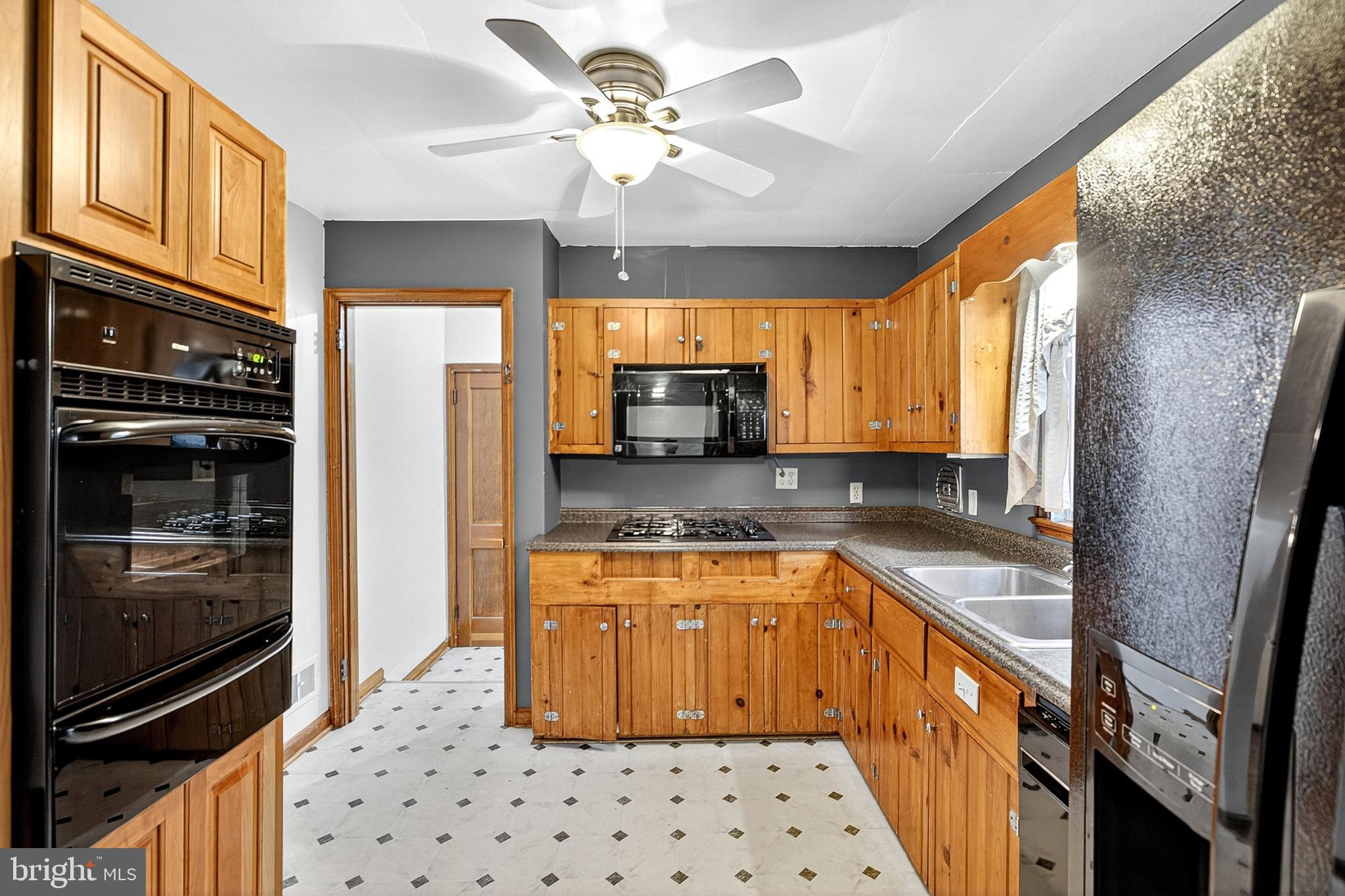 721 South Halsey Road Dover, DE 19901 - Photo 12 of 41 Charming kitchen with warm wood accents.