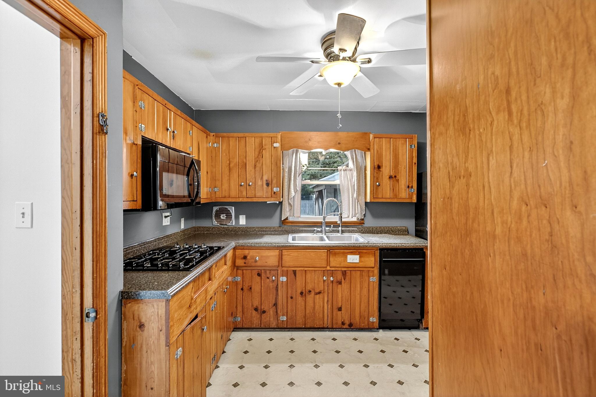 721 South Halsey Road Dover, DE 19901 - Photo 13 of 41 Charming kitchen with warm wood accents.