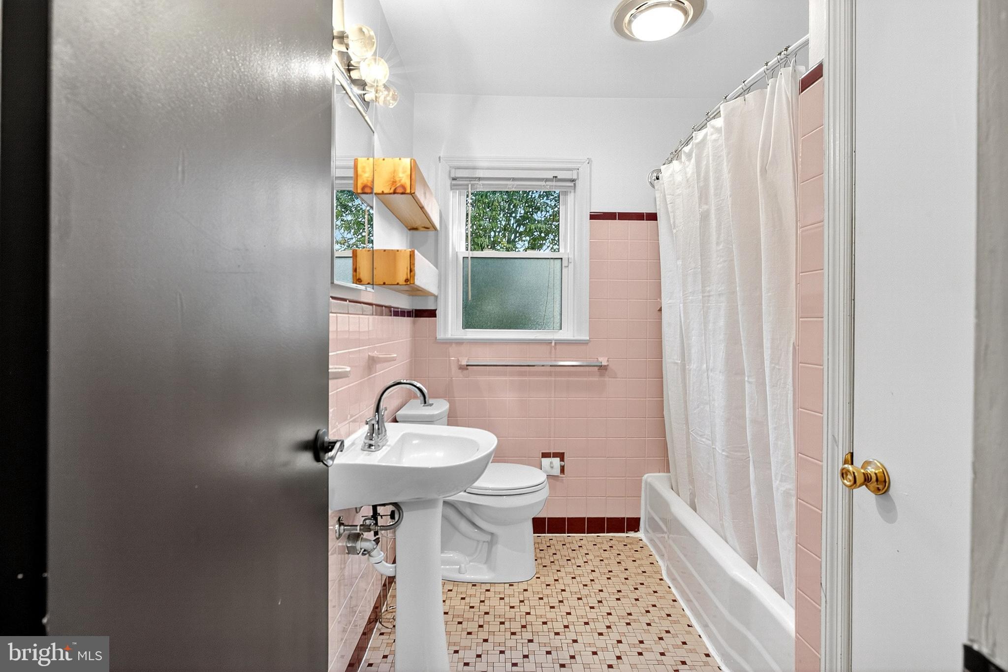 721 South Halsey Road Dover, DE 19901 - Photo 16 of 41 Charming vintage bathroom with pastel tiles.