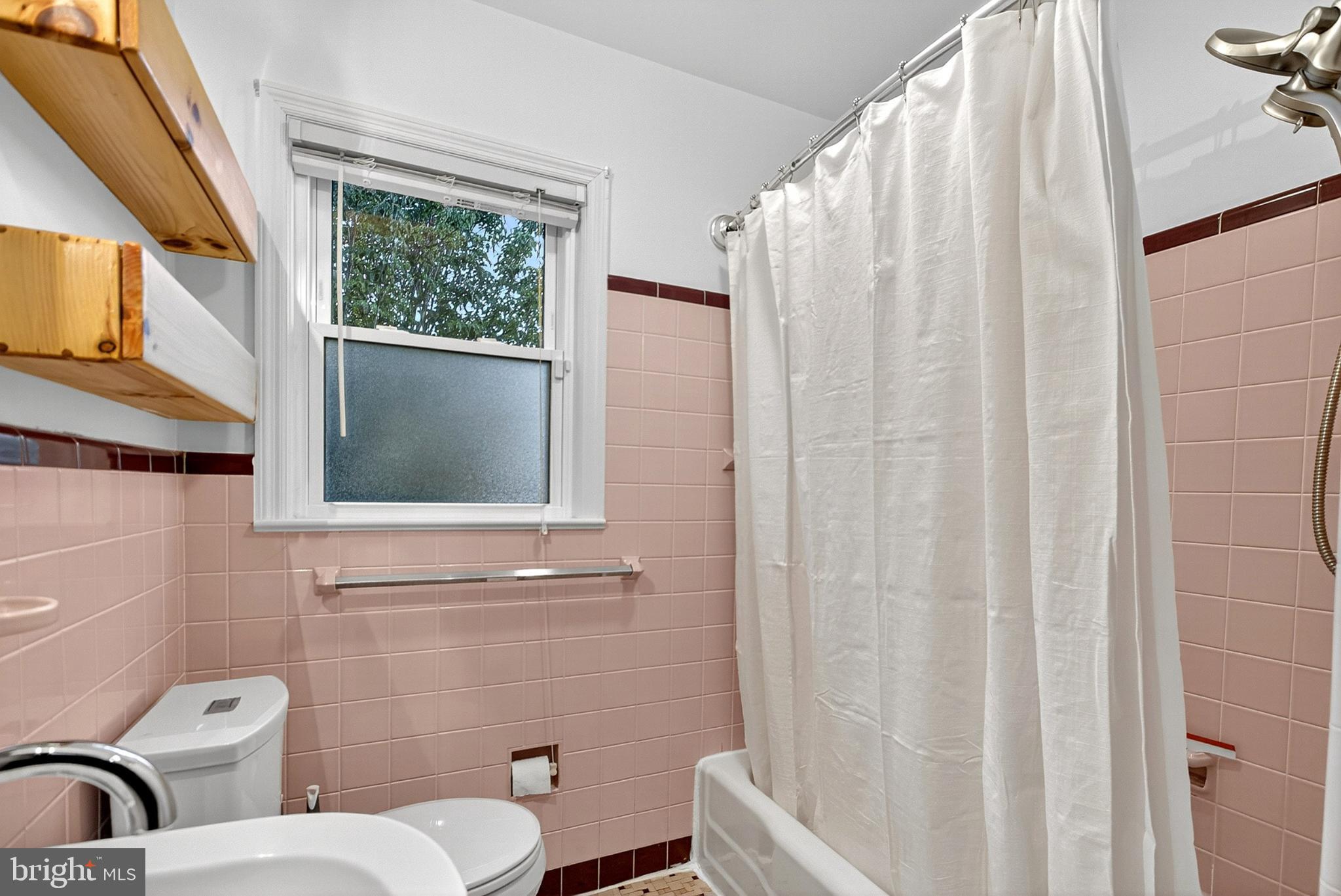 721 South Halsey Road Dover, DE 19901 - Photo 17 of 41 Charming vintage bathroom with pink tiles.