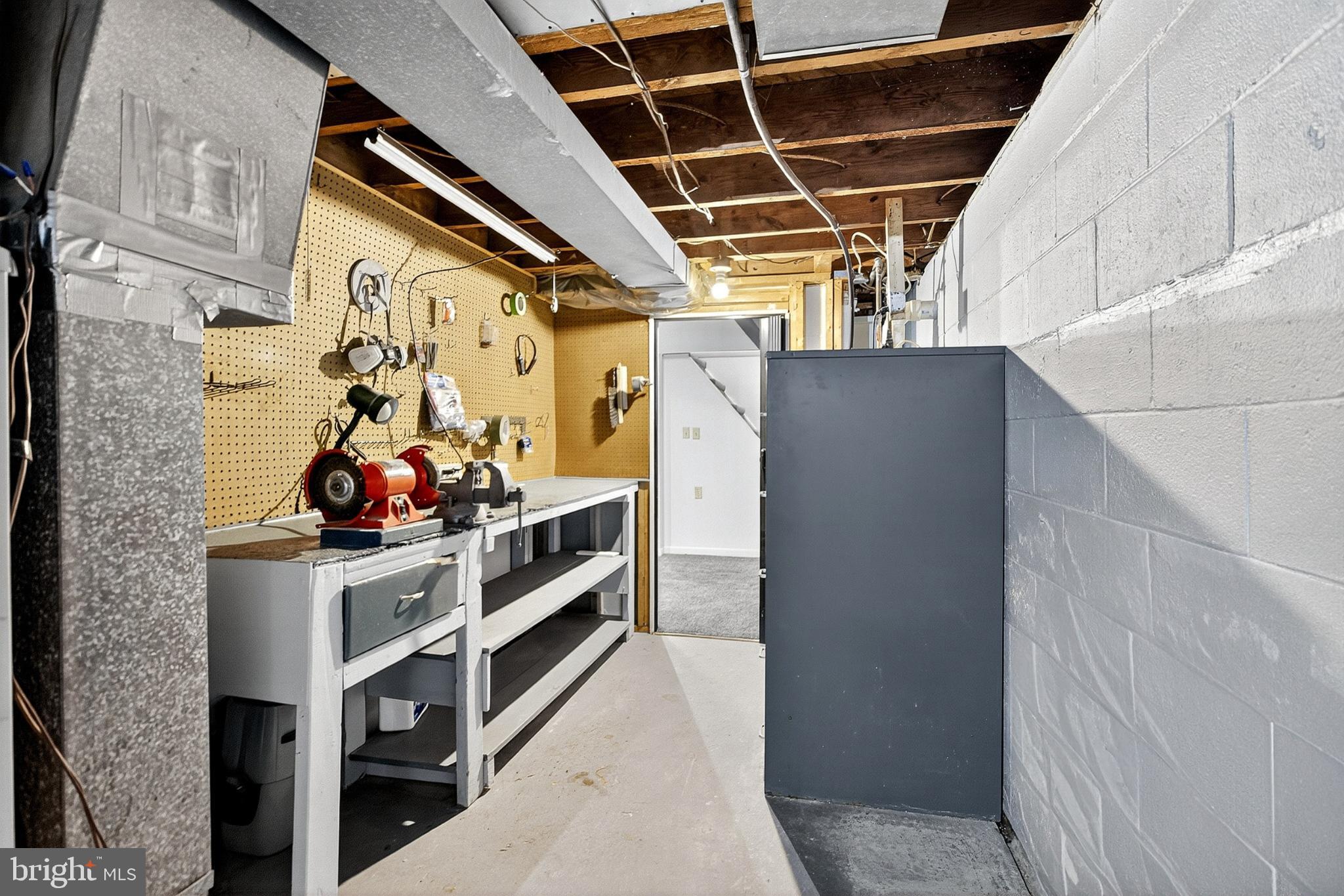 721 South Halsey Road Dover, DE 19901 - Photo 33 of 41 Spacious basement workshop with ample storage.