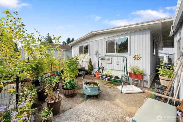 a front view of a house with outdoor seating
