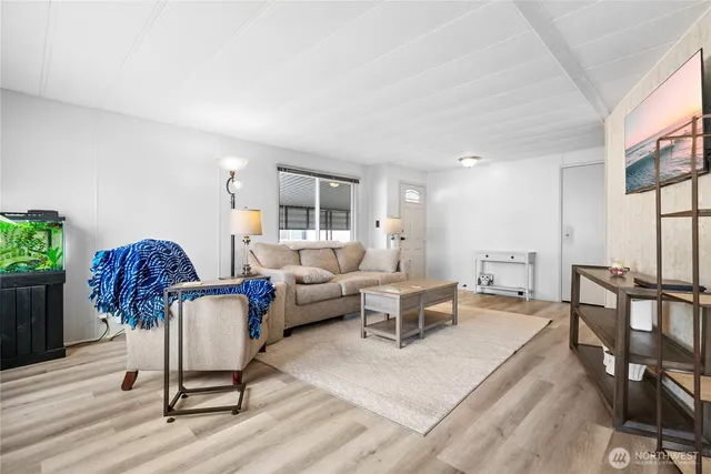 a living room with furniture and a table